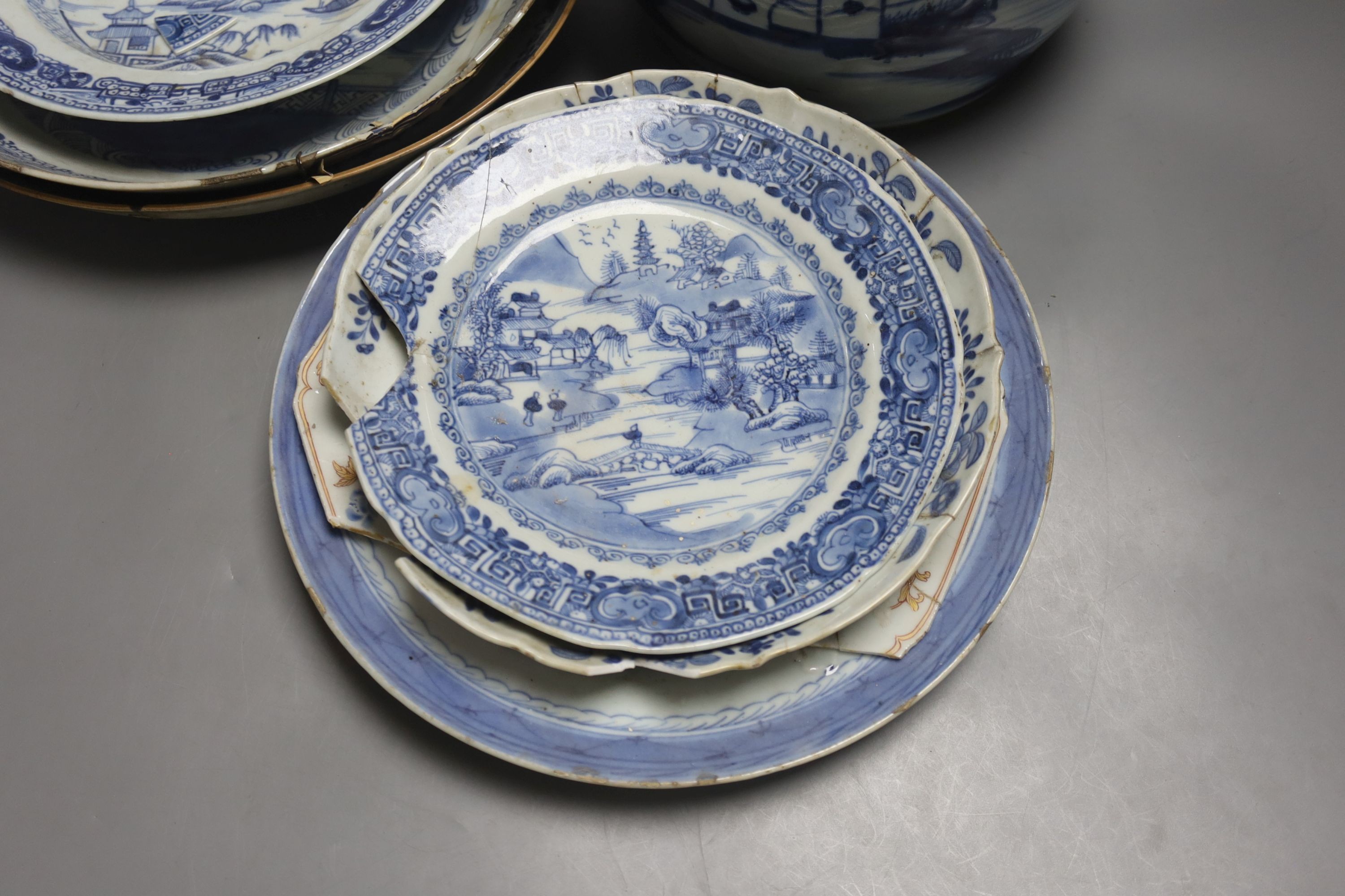 A group of 18th century Chinese export blue and white dishes, plates and a jar, the jar 21.5cm high
